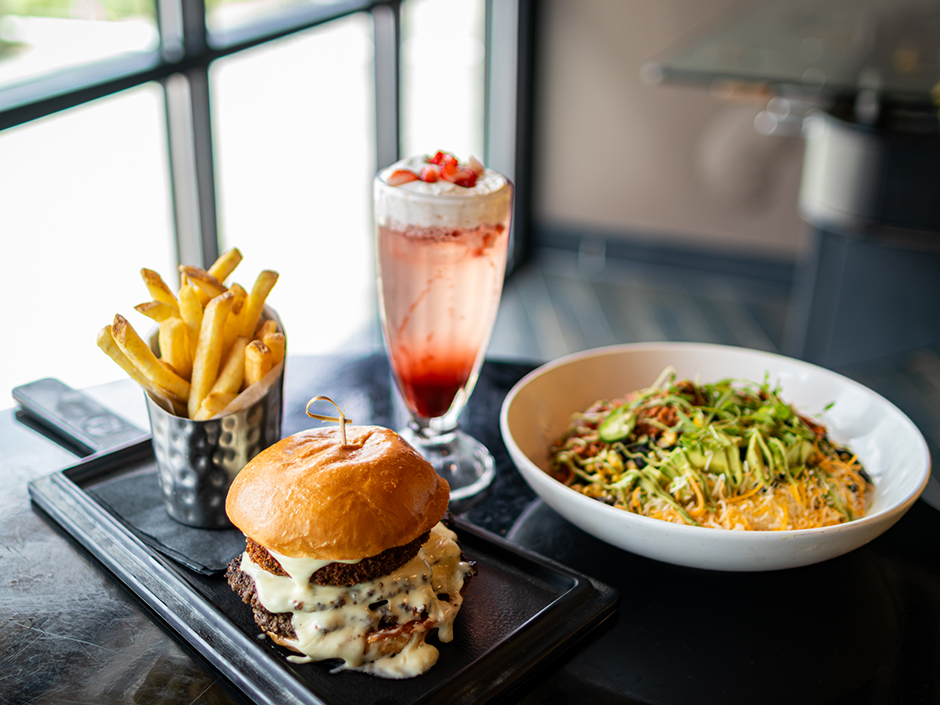 Plate of food and drinks for NFL Season at NBC Sports Grill & Brew in Universal CityWalk.