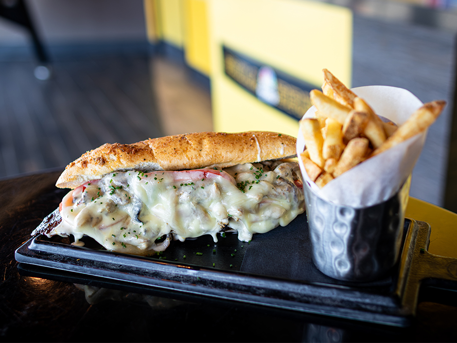 Plate of the Slam Dunk Chicken Bacon Ranch Sammie and fries at NBC Sports Grill & Brew for the NBA Tip-Off.