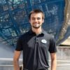 Bobby Spina poses in front of the Universal Orlando Resort globe